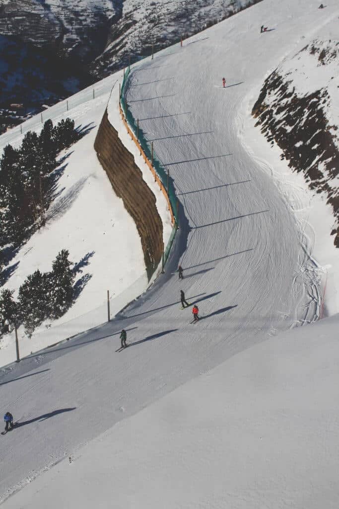 skiers going down a hill