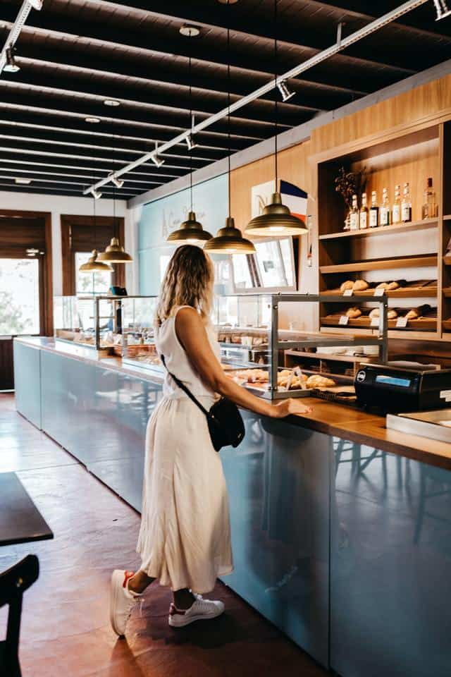 blonde lady at bakery counter