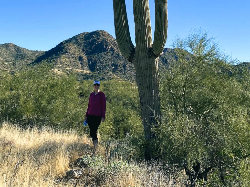 woman standing by cactus