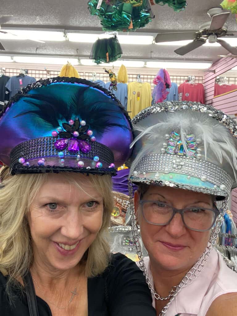 Two ladies with crazy hats on in New Orleans.